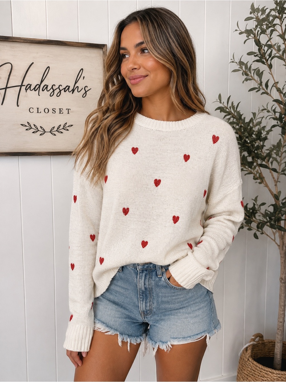 White sweater with red hearts
